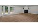 Bright open living area with access to the deck and fireplace at 4705 Bernie Pl, Raleigh, NC 27616