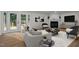 Cozy living room featuring a fireplace and french doors to the deck at 4705 Bernie Pl, Raleigh, NC 27616