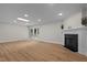 Spacious living room features hardwood floors, recessed lighting, fireplace and french doors to the backyard at 4705 Bernie Pl, Raleigh, NC 27616