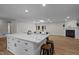 Open concept living area with fireplace and kitchen access at 4705 Bernie Pl, Raleigh, NC 27616