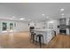 Large open-concept living space with an island and hardwood floors at 4705 Bernie Pl, Raleigh, NC 27616