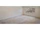 Spacious bedroom with neutral carpeting and a window offering ample natural light at 4800 Howe St, Durham, NC 27705