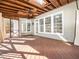 Spacious screened porch with wood beam ceiling at 4916 Brambleridge Ct, Holly Springs, NC 27540