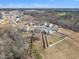 Serene neighborhood aerial shot featuring charming homes with expansive backyards and tree-lined surroundings at 492 Arlie Ln, Lillington, NC 27546
