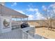 View of screened-in back deck with scenic views, grill, and comfortable seating at 492 Arlie Ln, Lillington, NC 27546