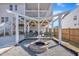 Back patio with cozy seating, fire pit, and outdoor entertaining space at 492 Arlie Ln, Lillington, NC 27546