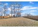 Backyard view with a privacy fence and mature trees at 492 Arlie Ln, Lillington, NC 27546