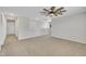 Upstairs bonus room with neutral colored walls and carpeted floors at 492 Arlie Ln, Lillington, NC 27546