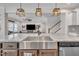 Kitchen with a large island, stainless steel sink, and a view into the living room at 492 Arlie Ln, Lillington, NC 27546