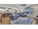 Open-concept living room with a comfortable sofa, an accent rug, and an open view of the kitchen at 492 Arlie Ln, Lillington, NC 27546