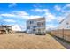 Rear exterior view showcasing the deck, patio, and spacious backyard at 492 Arlie Ln, Lillington, NC 27546