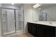 Contemporary bathroom featuring double vanity, quartz countertops, and a glass enclosed shower at 5004 Cambrey Dr # 3, Durham, NC 27703