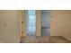 Hallway with neutral carpet leading to two bedrooms at 5004 Cambrey Dr # 3, Durham, NC 27703