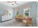 Charming Bedroom with a crib, rocking chair, and soft pastel colors at 53 Mildred Pl, Broadway, NC 27505