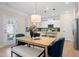 Cozy dining area with modern pendant lighting and a view of the kitchen at 53 Mildred Pl, Broadway, NC 27505