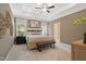 Tranquil main bedroom with soft lighting, a ceiling fan, and a king-sized bed at 53 Mildred Pl, Broadway, NC 27505