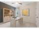 Well-lit home office with a desk, shelving, and a view of the outdoors at 53 Mildred Pl, Broadway, NC 27505