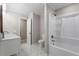 Clean, well-lit bathroom featuring double sinks, toilet, and shower-tub combination at 567 Howard Tant Rd, Zebulon, NC 27597