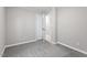 Minimalist bedroom featuring carpeted floors, neutral paint, and a closet for storage at 567 Howard Tant Rd, Zebulon, NC 27597