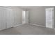 Spacious bedroom featuring carpeted floors, closet, and an ensuite bathroom at 567 Howard Tant Rd, Zebulon, NC 27597