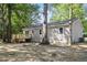Rear exterior view of the home featuring siding, a deck, and a spacious backyard at 567 Howard Tant Rd, Zebulon, NC 27597