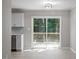 Partial view of the Kitchen looking out through sliding glass doors to an outdoor deck area at 567 Howard Tant Rd, Zebulon, NC 27597
