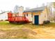 View of the home's backyard, featuring a red deck, siding, and yard at 5748 Presentation St, Knightdale, NC 27545