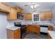 This kitchen has stainless steel appliances, light wood cabinetry, and marble countertops at 5748 Presentation St, Knightdale, NC 27545