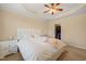 Spacious main bedroom with a king bed, ceiling fan and walk-in closet at 5923 Cameo Glass Way, Raleigh, NC 27612