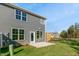 This house features a concrete patio, a fenced yard, and fresh green grass at 602 Andrade Dr, Fuquay Varina, NC 27526