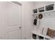 This white mudroom offers storage cubbies, hooks, and a bench at 602 Andrade Dr, Fuquay Varina, NC 27526