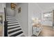 This staircase features black stairs and neutral paint at 6301 Kayton St, Raleigh, NC 27616