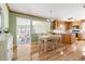 Open kitchen and dining area with hardwood floors and lots of natural light at 634 Hillhaven Ter, Roxboro, NC 27573