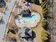 Aerial view of community pool, playground and amenities with mature landscaping at 684 Wickham Ridge Rd, Apex, NC 27539