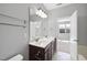 This bathroom features double sinks, neutral color scheme, and natural light at 684 Wickham Ridge Rd, Apex, NC 27539
