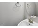 Bathroom featuring stainless steel hardware, sink and modern lighting at 684 Wickham Ridge Rd, Apex, NC 27539