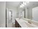 This bathroom has double sinks, a walk in closet, and a neutral color scheme at 684 Wickham Ridge Rd, Apex, NC 27539