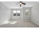 This spacious bedroom features neutral carpet, natural light, and a ceiling fan at 684 Wickham Ridge Rd, Apex, NC 27539