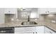 Kitchen sink featuring stainless steel hardware, stone countertops and stainless steel appliances at 684 Wickham Ridge Rd, Apex, NC 27539