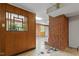 Finished basement with brick accents and vintage shuffleboard game at 703 Caswell Rd, Chapel Hill, NC 27514
