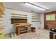 Spacious basement with workbench, open shelving and concrete flooring at 703 Caswell Rd, Chapel Hill, NC 27514