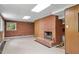 Basement with a brick fireplace and windows at 703 Caswell Rd, Chapel Hill, NC 27514