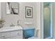 Charming bathroom with a vintage sink and bright blue toilet at 703 Caswell Rd, Chapel Hill, NC 27514