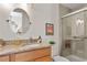 Updated bathroom with granite counters, tiled shower, and modern fixtures at 703 Caswell Rd, Chapel Hill, NC 27514