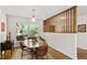 Bright dining room with hardwood floors, decorative partition, and natural light at 703 Caswell Rd, Chapel Hill, NC 27514