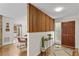 Spacious foyer with wood floors, wooden partition, and stylish decor at 703 Caswell Rd, Chapel Hill, NC 27514