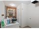 Bright laundry area featuring a utility sink, laundry machine, and ample storage space at 703 Caswell Rd, Chapel Hill, NC 27514