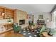 Cozy living room featuring brick fireplace, built-in shelves, and stylish furniture at 703 Caswell Rd, Chapel Hill, NC 27514