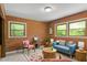 Charming living room featuring exposed brick wall and ample seating at 703 Caswell Rd, Chapel Hill, NC 27514