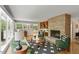 Inviting living room with fireplace and view to outdoor deck at 703 Caswell Rd, Chapel Hill, NC 27514